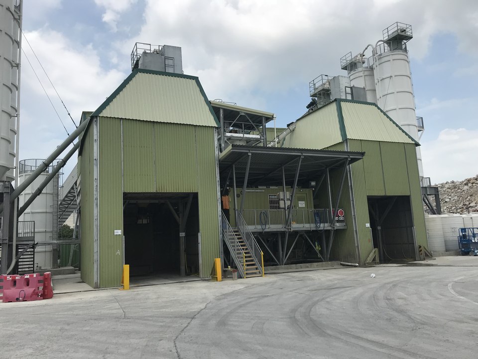 Completed concrete batching plant with enclosed processing structures