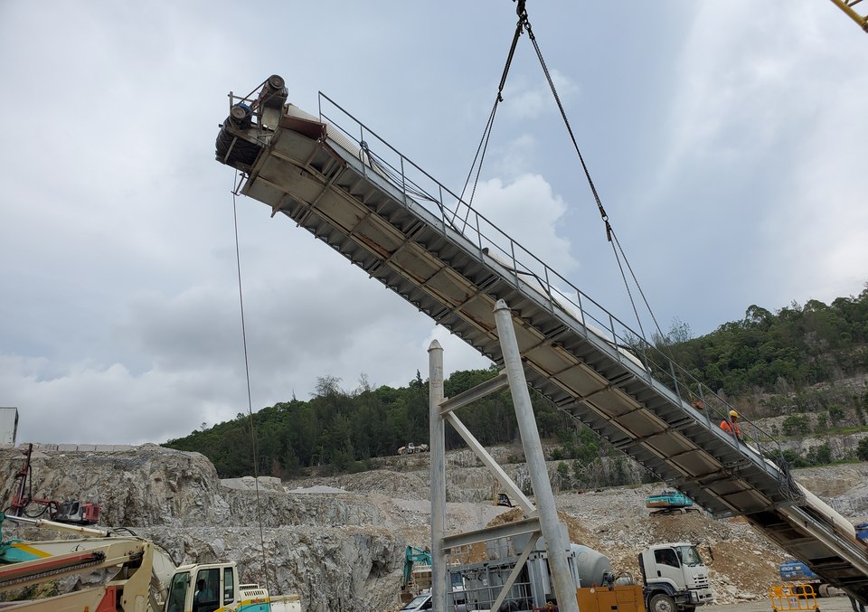 Conveyor section being lifted into position during plant alteration work
